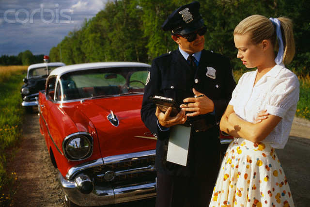 Police Officers Giving Woman Traffic Ticket